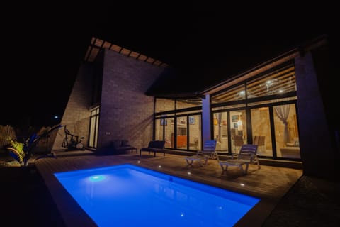 Property building, Patio, Night, Pool view, Swimming pool