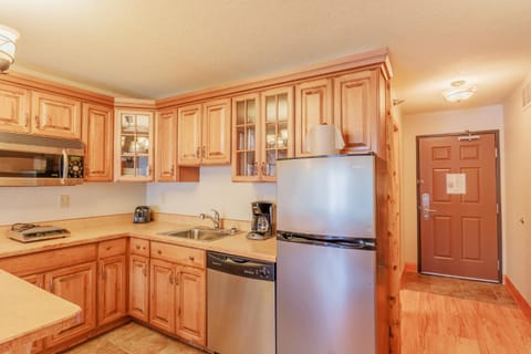 Kitchen or kitchenette, dishwasher, oven, stove, toaster