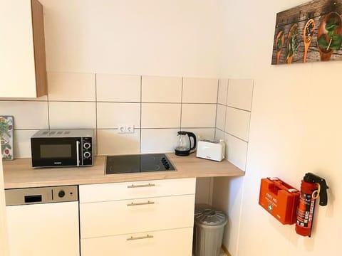 Kitchen or kitchenette, dishwasher, oven, stove, toaster