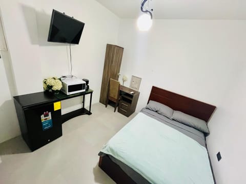 Bed, TV and multimedia, Bedroom, microwave