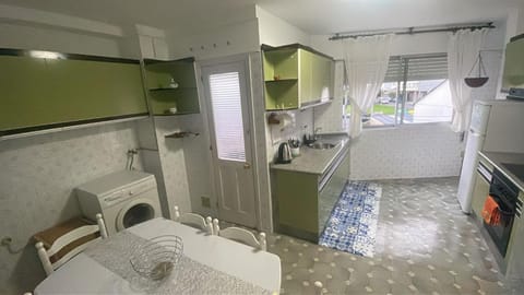 Kitchen or kitchenette, washing machine