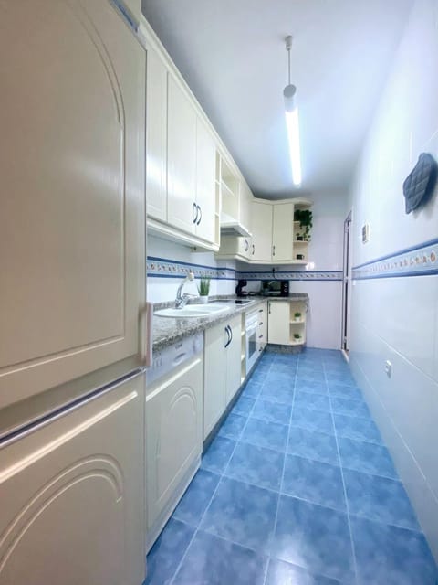 Kitchen or kitchenette, dishwasher, microwave, oven, stove