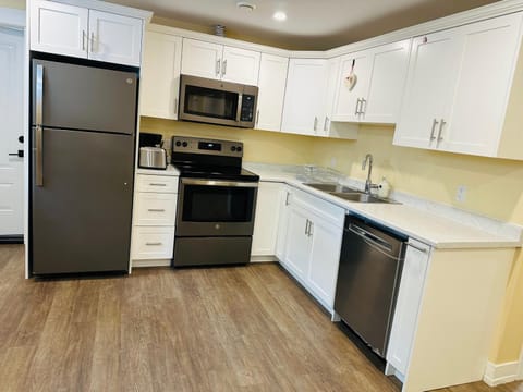 Kitchen or kitchenette, dishwasher, stove, toaster