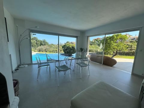 Living room, Dining area, Pool view