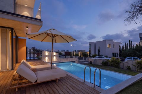 Property building, Night, Pool view, Swimming pool, sunbed