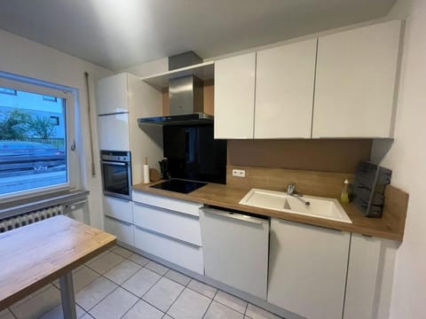 Kitchen or kitchenette, dishwasher, oven, stove