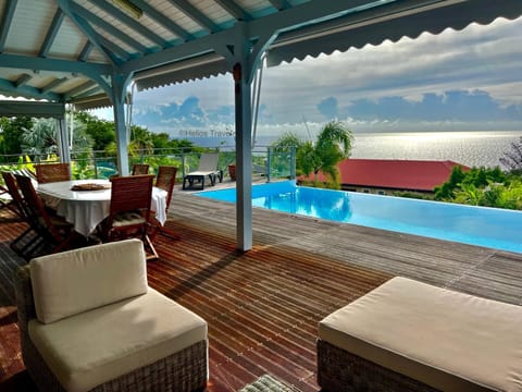 Patio, Day, Natural landscape, View (from property/room), Balcony/Terrace, Living room, Seating area, Garden view, Pool view, Sea view, Swimming pool, sunbed