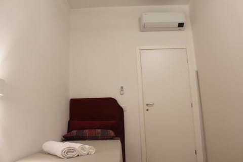 Bed, Photo of the whole room, Bedroom, towels, air conditioner