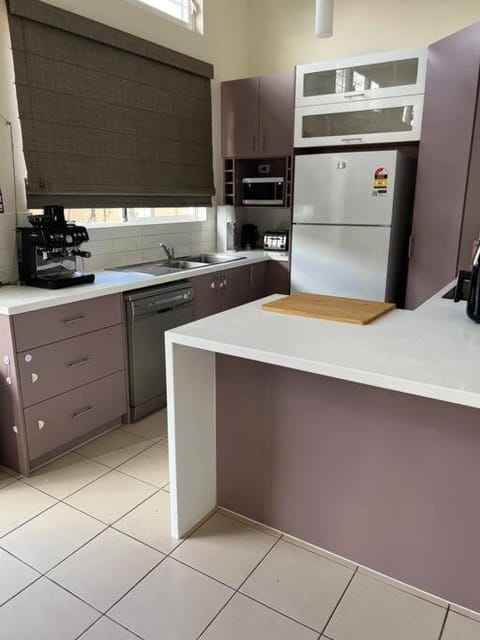 Kitchen or kitchenette, dishwasher, oven, stove