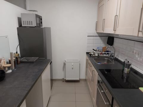 Kitchen or kitchenette, dishwasher, heating, microwave, oven, stove, toaster