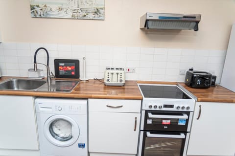 Kitchen or kitchenette, washing machine