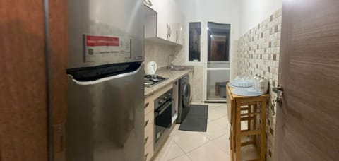 Kitchen or kitchenette, oven, washing machine