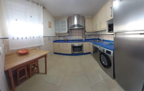 Kitchen or kitchenette, dishwasher, oven, stove, toaster, washing machine