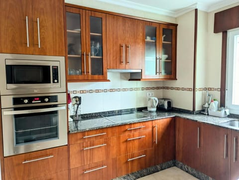 Kitchen or kitchenette, oven, stove, toaster