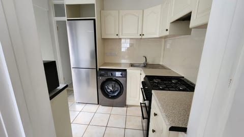 Kitchen or kitchenette, washing machine