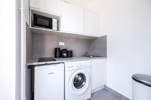 Kitchen or kitchenette, washing machine