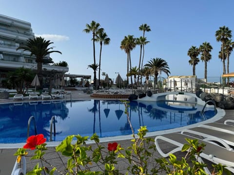 Property building, Day, Pool view, Swimming pool, sunbed