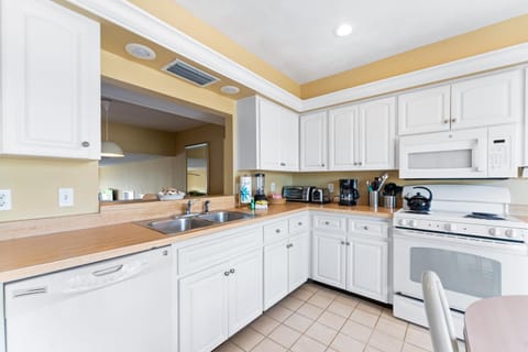 Kitchen or kitchenette, dishwasher, oven, stove