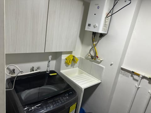 Kitchen or kitchenette, washing machine