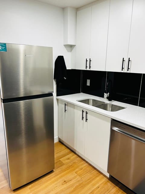 Kitchen or kitchenette, dishwasher, oven, stove