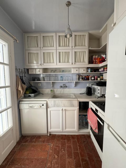 Kitchen or kitchenette, dishwasher, oven, stove