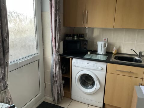 Kitchen or kitchenette, washing machine