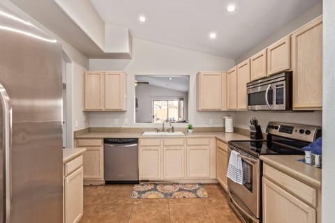 Kitchen or kitchenette, dishwasher, oven, stove