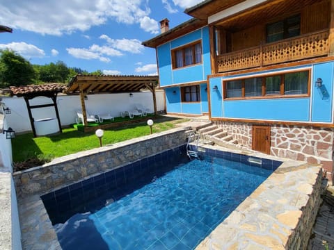 Property building, Patio, Day, Pool view, sunbed