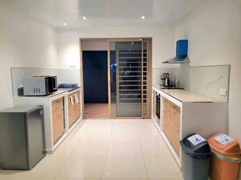 Kitchen or kitchenette, microwave, oven, storage, stove, kitchen