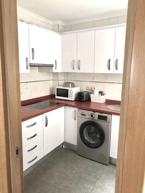 Kitchen or kitchenette, washing machine