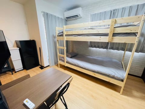 Communal lounge/ TV room, Bed, TV and multimedia, Living room, Bedroom, bunk bed, air conditioner