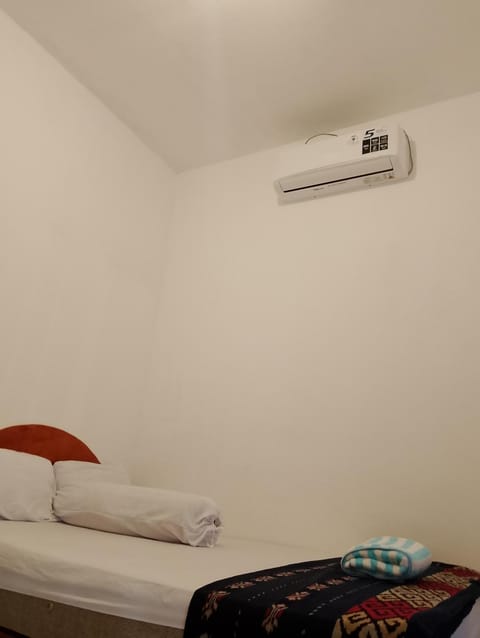 Bed, air conditioner