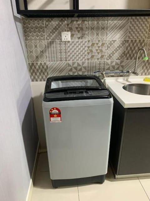 Kitchen or kitchenette, washing machine