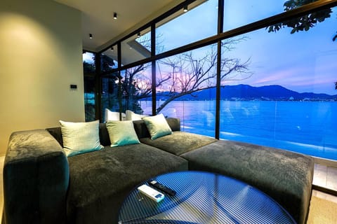 Natural landscape, Living room, Seating area, Dining area, Beach, Mountain view, Sea view, Sunset