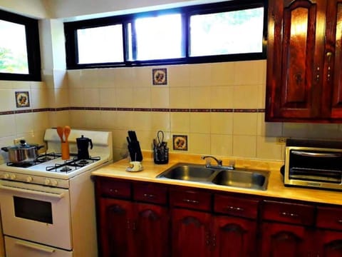 Kitchen or kitchenette, stove, toaster