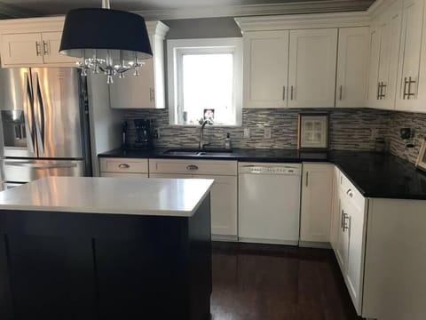 Kitchen or kitchenette, dishwasher, oven, stove