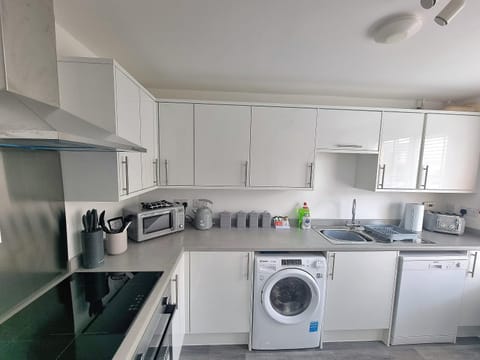 dishwasher, flat iron, microwave, stove, washing machine, kitchen