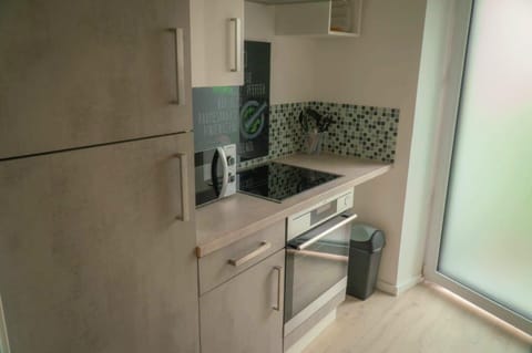 Kitchen or kitchenette, dishwasher, oven, stove