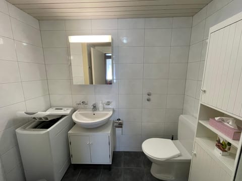 Bathroom, hair dryier, washing machine