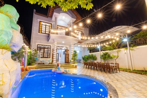 Property building, Patio, Night, Pool view, Swimming pool, sunbed