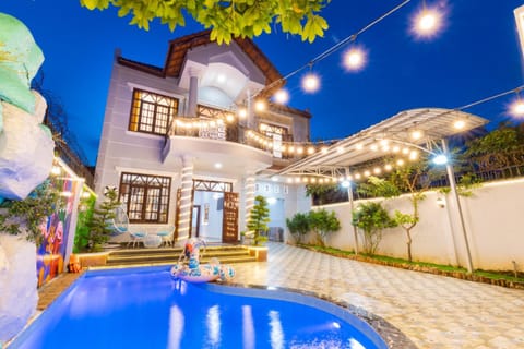 Property building, Patio, Night, Pool view, Swimming pool