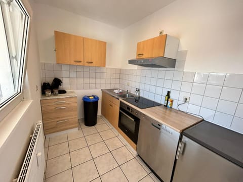 Kitchen or kitchenette, dishwasher, oven, stove