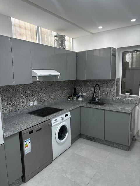 Kitchen or kitchenette, dishwasher, oven, stove, washing machine