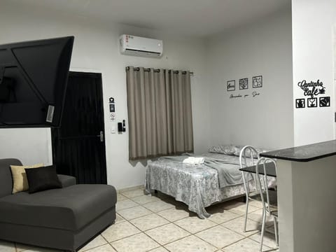 Bed, TV and multimedia, Living room, Photo of the whole room, Seating area, Bedroom, air conditioner