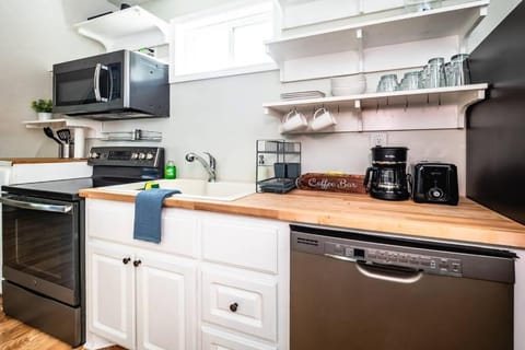 Kitchen or kitchenette, dishwasher, oven, stove, toaster