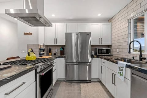 Kitchen or kitchenette, dishwasher, oven, stove