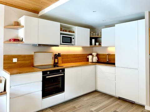 Kitchen or kitchenette, dishwasher, oven, stove