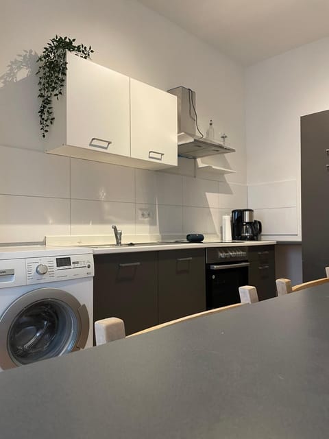 Kitchen or kitchenette, washing machine