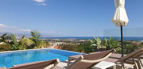 View (from property/room), Pool view, Sea view, Swimming pool