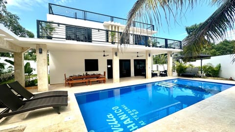 Property building, Patio, Pool view, Swimming pool, sunbed